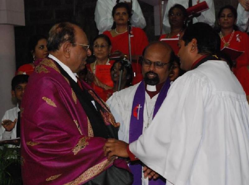 Felicitation by church for service in music.
